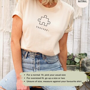 This natural t-shirt has a black image of a puzzle piece centred in the middle, with the word therapy underneath. Tailored towards people who enjoy puzzles also who find puzzles a form of therapy.