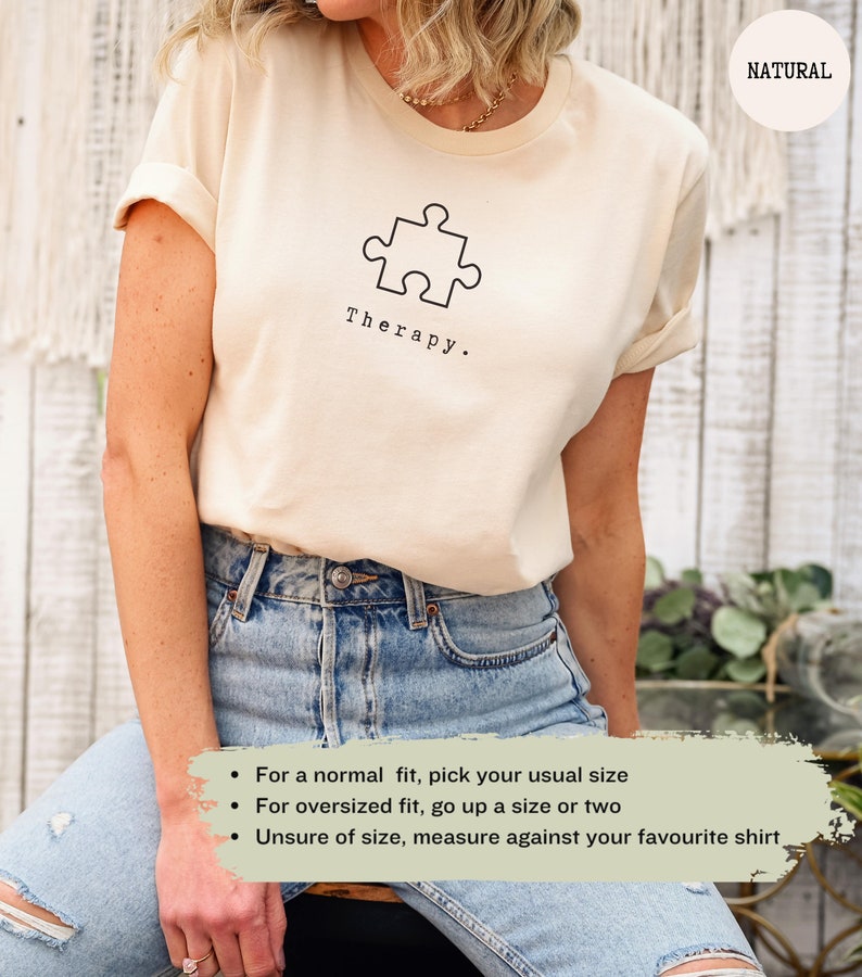 This natural t-shirt has a black image of a puzzle piece centred in the middle, with the word therapy underneath. Tailored towards people who enjoy puzzles also who find puzzles a form of therapy.