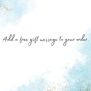 May include: A white background with a blue watercolor design and gold glitter. The text "Add a free gift message to your order." is written in black.
