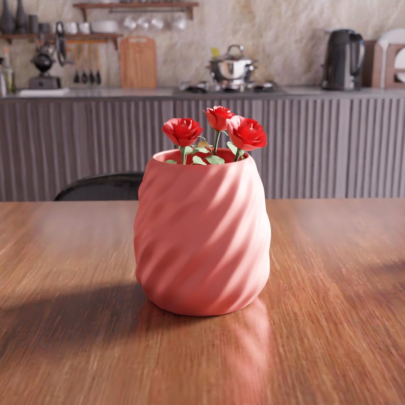 May include: A pink ceramic vase with a swirling pattern, holding a bouquet of red roses.