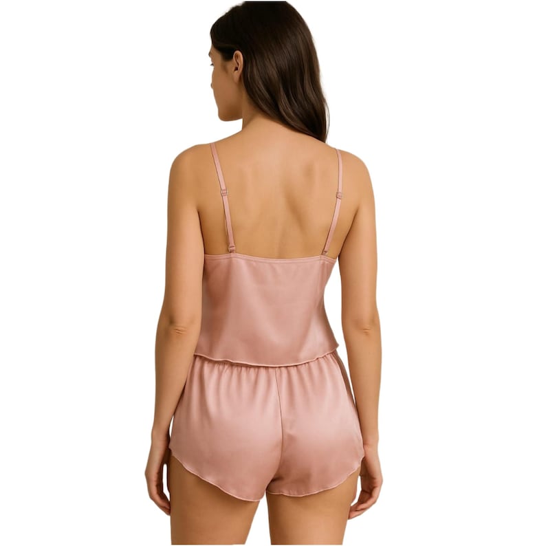 May include: A two-piece pajama set in a dusty rose color. The top is a sleeveless cami with a V-neckline and the shorts are a relaxed fit with a drawstring waist.