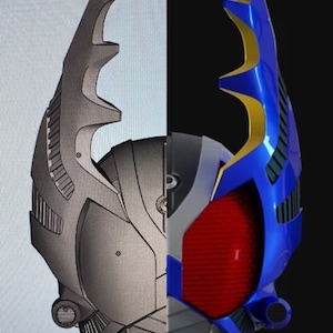 May include: A 3D printed model of a blue and silver helmet with a red eye lens and a gold and blue antenna. The helmet is half finished and the other half is a 3D model.