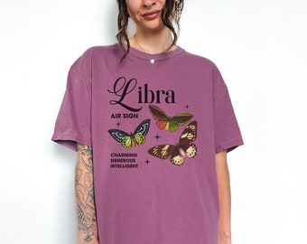 May include: Purple oversized t-shirt with a graphic of butterflies and the text "Libra Air Sign Charming Generous Intelligent".