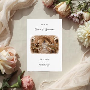May include: A white wedding invitation with the text "Save the Date" and the names "Diana & Giovanni" in elegant script. The invitation features a watercolor image of a wedding reception venue and the date "25.06.2021".