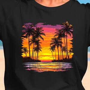 May include: A black t-shirt with a colorful sunset scene featuring palm trees and a reflection of the scene in the water.