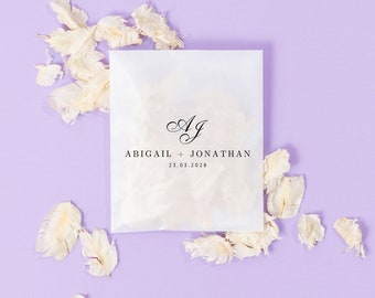Bruiloftconfetti + tassen | Ivoorkleurige confetti | Gepersonaliseerde tassen | Biologisch afbreekbare confetti | Gedroogde, echte bloemblaadjes | Pergamijn pakjes + confetti