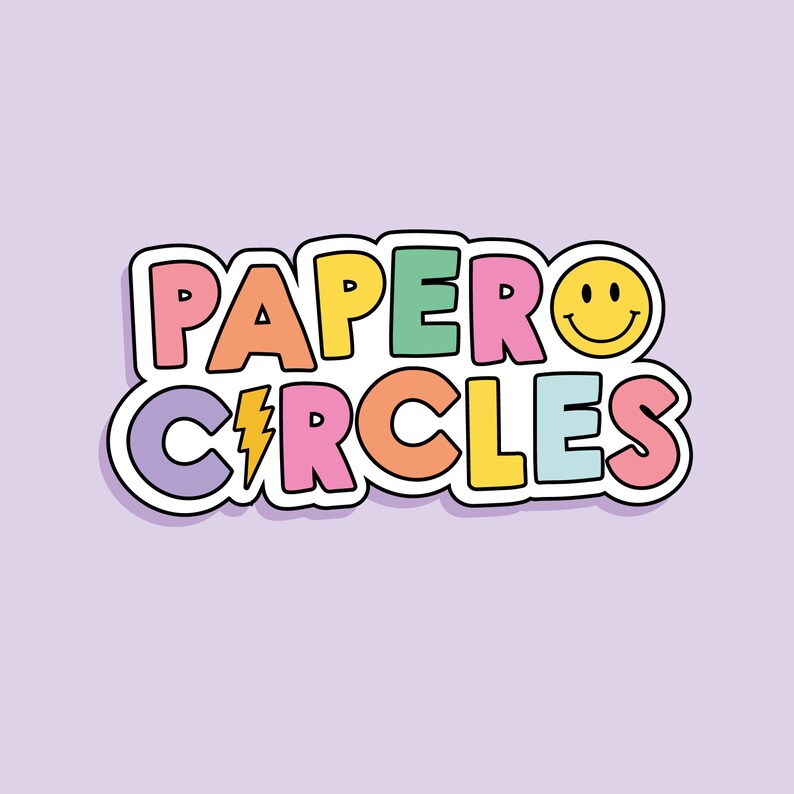 May include: A colorful graphic design with the text "PAPER CIRCLES" in a rainbow of colors with a yellow smiley face. The text is outlined in black and has a white shadow.