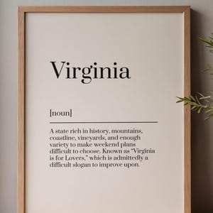 May include: A framed wall art print featuring the word Virginia followed by the noun definition: A state rich in history, mountains, coastline, vineyards, and enough variety to make weekend plans difficult to choose. Known as Virginia is for Lovers.