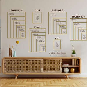 May include: A wall art size guide showing different ratios and sizes listed in inches and centimetres. The guide includes ratios such as 2:3, 3:4, 4:5, and 11x14. It also includes standard paper sizes like A1, A2, A3, and A4. The guide is displayed on a white wall with a wooden shelf below it.