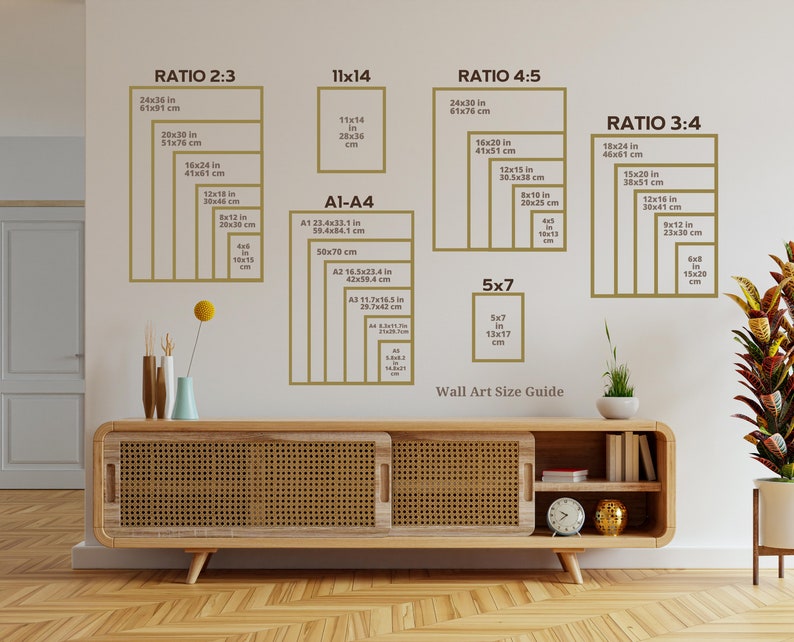 May include: A wall art size guide showing different ratios and sizes listed in inches and centimetres. The guide includes ratios such as 2:3, 3:4, 4:5, and 11x14. It also includes standard paper sizes like A1, A2, A3, and A4. The guide is displayed on a white wall with a wooden shelf below it.