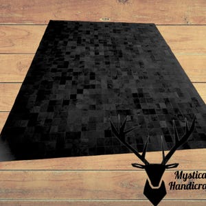 Handmade Black Cowhide Patchwork Rug: Luxurious Home Decor