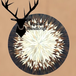 May include: A round, multi-colored leather rug with a starburst pattern. The rug is made of different colored cowhide patches. The rug is surrounded by a black border. The text "Mystical Handicraft" is printed in black on the rug.