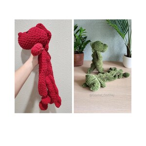 May include: Two crocheted dinosaur toys, one red and one green. The red dinosaur is held in a hand, while the green dinosaur is lying on a wooden surface. The green dinosaur is labeled with the text "@Crochet CroChey".