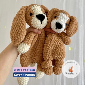 May include: Two crocheted dog plushies, one larger than the other. Both are brown with white accents and black eyes. The larger plush is a lovey with a flat back and long ears. The smaller plush is a traditional plush toy. The text "2-IN-1 PATTERN LOVEY + PLUSHIE" is on the image.