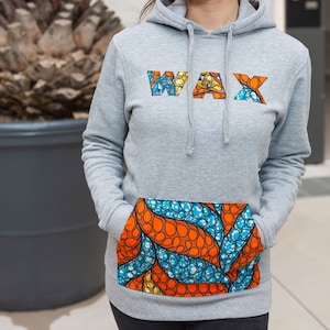 Einzigartiges Kapuzensweatshirt: Kombinieren Sie Komfort und Originalität mit unserer personalisierten Kreation aus Wachsstoff!