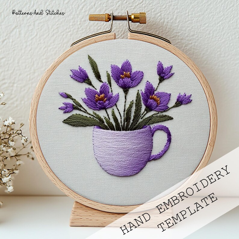 Satin Stitch Embroidery Pattern PDF Purple Crocus Mug Design DMC Thread Color Reference Stem Stitch Technique French Knot Stamen Detail Lazy Daisy Pointed Petal Method Padded Satin Crocus Volume Dense Solid Fill Lavender Cup Body Split Stitch Cup Outline Hoop Art Format Gold Metal Hoop Display Printable Template Instant Digital Download Full DMC Color Chart Step By Step Stitch Diagram Botanical Crocus Saffron Motif Violet Purple Olive Green Gold Orange Thread Palette Beginner Instructions