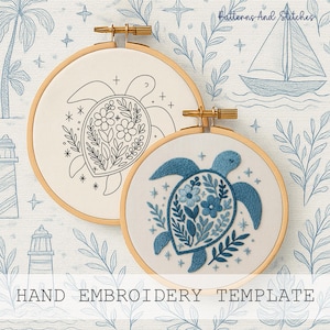 May include: Two wooden embroidery hoops with turtle designs. One hoop features a black outline, the other a blue embroidered turtle with floral details. The background is a light blue pattern with the text "Patterns And Stitches" and "HAND EMBROIDERY TEMPLATE".
