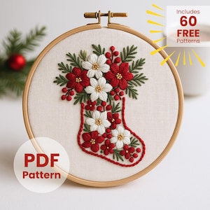 Puede incluir: Diseño de calcetín navideño bordado en un aro de madera. El calcetín está lleno de flores rojas y blancas y hojas verdes. El texto "PDF Pattern" está en un círculo blanco. También es visible el texto "Includes 60 FREE Patterns".