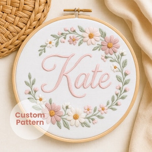 Elegant floral name embroidery pattern, stitched daisies, soft pink blossoms, botanical greenery, graceful calligraphy, PDF in 6 hoop sizes