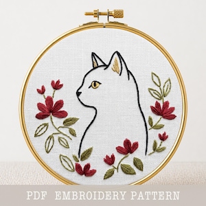 Cat Silhouette Embroidery Pattern PDF Digital Download White Cat Profile Floral Wreath Design Modern Hand Stitching Hoop Art Needlework Chart Outline Cat Stitch PDF Beginner Friendly Red Flower Botanical Embroidery Instant Download Gold Eye Detail Cat Portrait Printable Template Multiple Size Options Crimson Magnolia Flower Motif DMC Color Chart Hand Embroidery Outline Cat PDF Floral Wreath Needlework Cat Profile Stitch Chart Decorative Botanical Hoop Art Digital Download Complete Instructions