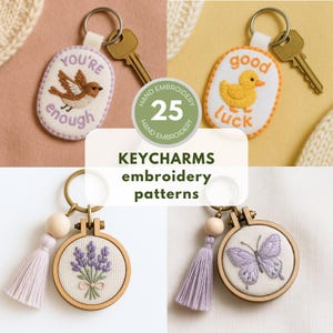 May include: A collection of keychains with embroidered designs. The keychains feature various motifs, including a bird, a duck, lavender, and a butterfly. The text "YOU'RE enough" and "good luck" are visible. The image also includes the text "KEYCHARMS embroidery patterns".