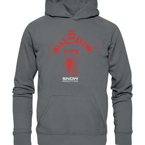 May include: A dark grey hoodie with a red graphic of a snowboarder holding a snowboard. The text "SNOW ADDICTION" is printed in red below the graphic. The hoodie has a hood and a front pocket.