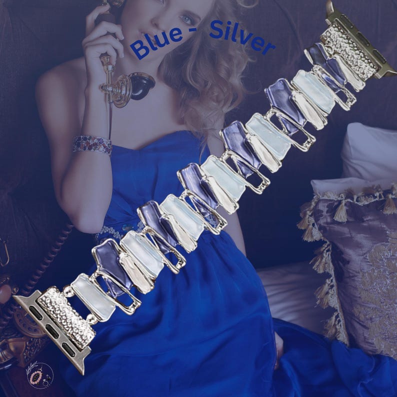 May include: A silver and blue Apple Watch band with a geometric design. The band is made of metal and has a sparkly finish. The text "Blue - Silver" is visible in the image.