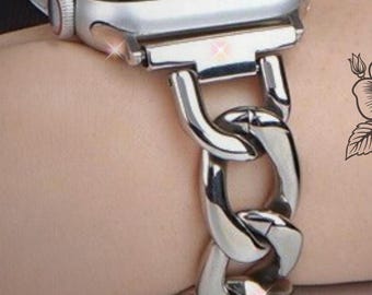 May include: Silver chain link Apple Watch band with a silver watch face.