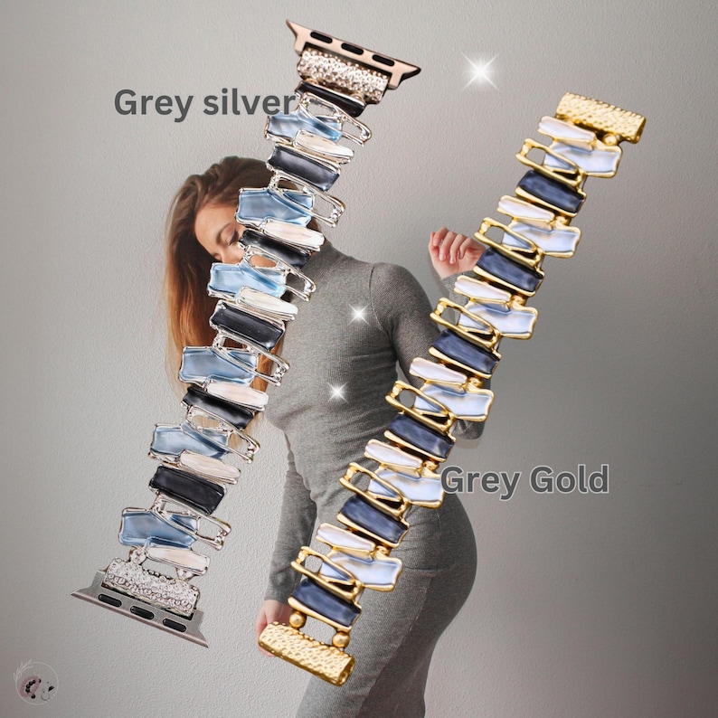 May include: Two Apple Watch bands with a geometric design. The band on the left is silver with blue and black accents. The band on the right is gold with blue and white accents. The text "Grey silver" is above the left band and "Grey Gold" is above the right band.