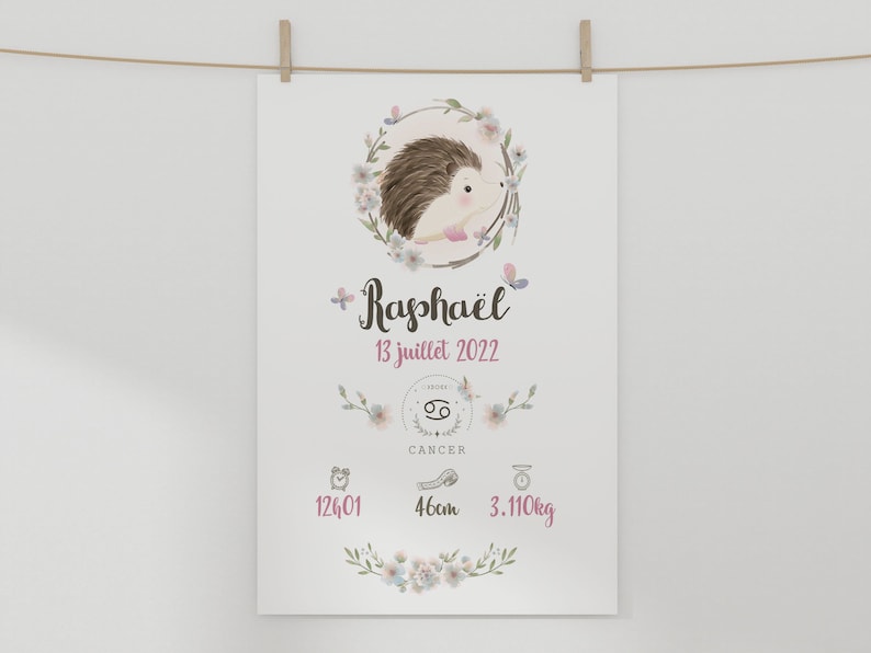 May include: A white printable birth announcement with a floral design. The announcement features a hedgehog illustration, the name "Rapha&euml;l", the date "13 juillet 2022", the zodiac sign Cancer, and the baby's birth stats: 12:01, 46cm, and 3.110kg.