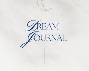 May include: A white background with a gold crescent moon with a face and the text "DREAM JOURNAL" in blue cursive script. Below the text is a vertical line and the text "A year of dreams" in blue cursive script.