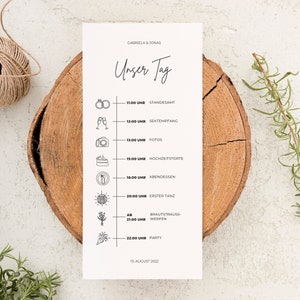 Könnte beinhalten: Eine Hochzeits-Tagesablaufkarte mit den Namen Gabriela & Jonas oben. Die Karte zeigt einen Zeitplan mit Illustrationen für jedes Ereignis, einschließlich Zeremonie, Fotos, Kuchen, Abendessen und Party. Das Datum ist der 13. August 2022.
