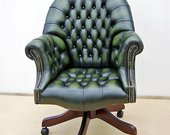 Director's Swivel chair, antique green leather with fully adjustable gas lift mechanism that rocks, tilts, swivels and goes up and down