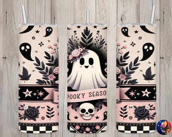 May include: A set of three pink and black stainless steel tumblers with a spooky season theme. The tumblers feature a ghost with a floral crown, black leaves, and the text "Spooky Season".