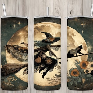 May include: A set of three stainless steel tumblers with a witch flying on a broomstick in front of a full moon. The witch is wearing a black dress and a pointed hat with flowers. A black cat is sitting on the broomstick. The background is a dark blue with stars.