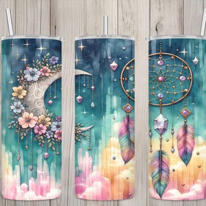 May include: Three stainless steel tumblers with watercolor designs. One features a crescent moon with flowers, another has a moon and hanging crystals, and the last displays a dreamcatcher with feathers. Each has a straw.