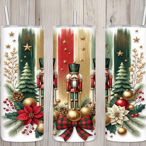 May include: White tumbler with a Christmas-themed design. Features a nutcracker soldier, Christmas tree, and festive ornaments. The design includes red, green, and gold accents, with a plaid bow and star details. Includes a silver straw.