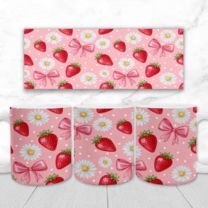 May include: White ceramic mug with a pink background featuring a pattern of red strawberries, white daisies, and pink bows. The design is repeated on a rectangular panel above the mug.