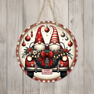 May include: Round Christmas sign featuring two gnomes in a red car decorated with a wreath, lights, and ornaments. The gnomes wear red and white hats. The sign has a red and white checkered border and the text "MERRY CHRISTMAS".