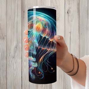 May include: A stainless steel tumbler featuring a colourful abstract jellyfish design. The jellyfish is a vibrant mix of blue, green, orange, and yellow.