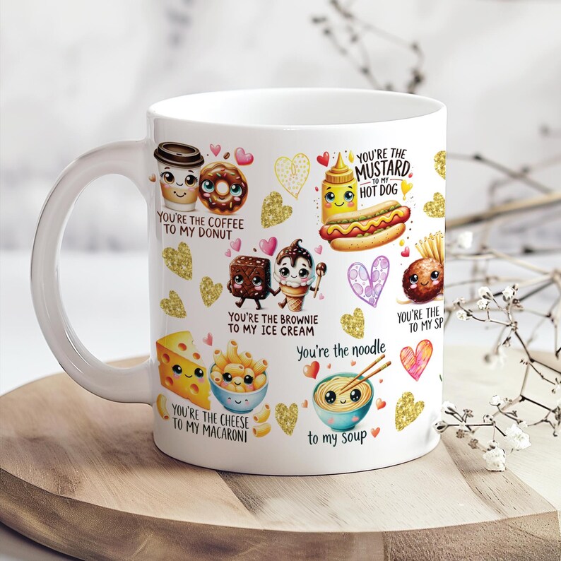 May include: White ceramic mug featuring cartoon food pairings with text like "You're the coffee to my donut" and "You're the mustard to my hot dog." Gold glitter hearts and other food illustrations decorate the mug.
