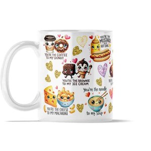 May include: White ceramic mug featuring cartoon food illustrations, including coffee, a donut, a brownie, ice cream, a hot dog, cheese, macaroni, and soup. Text on the mug reads "You're the coffee to my donut" and other food-related phrases.
