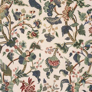 May include: Cream-colored fabric with a detailed floral pattern. The design features stylized flowers and foliage in shades of red, green, blue, and brown. The pattern is dense and intricate, creating a rich, textured appearance.