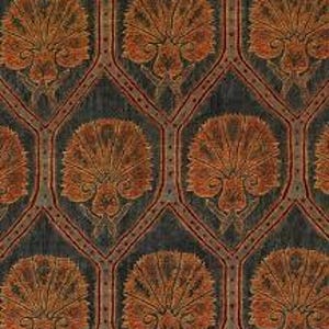 May include: Close-up of a patterned fabric featuring a repeating design of stylized, fan-shaped floral motifs in shades of orange and brown. The flowers are set against a dark blue-grey background within a diamond-shaped grid.