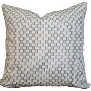 May include: Square decorative pillow with a repeating pattern of blue vertical rectangles on a cream background. The pillow has a soft, textured appearance and is designed for home decor. The pillow is approximately 20 inches square.