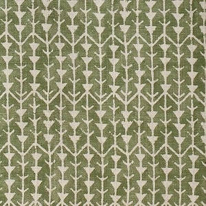 May include: A textile fabric featuring a repeating geometric pattern of white arrow-like shapes and vertical lines set against a solid olive green background. The design consists of interconnected, stylized branch motifs arranged in a symmetrical grid.