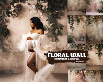 May include: A pregnant woman in a white gown stands in front of a backdrop with a floral wall. The backdrop is a neutral beige color with a textured surface. The text "Floral Wall 22 Neutral Backdrops by Fotofana" is printed on the backdrop.