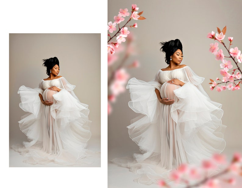 May include: A pregnant woman in a white flowing gown with a sheer overlay, standing in front of a light brown background with pink flowers on either side.