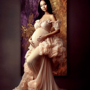 May include: A pregnant woman in a flowing, peach-colored gown with a ruffled skirt and off-the-shoulder neckline. The gown is sheer and has a delicate lace bodice. The woman is standing in front of a textured, gold and purple background.