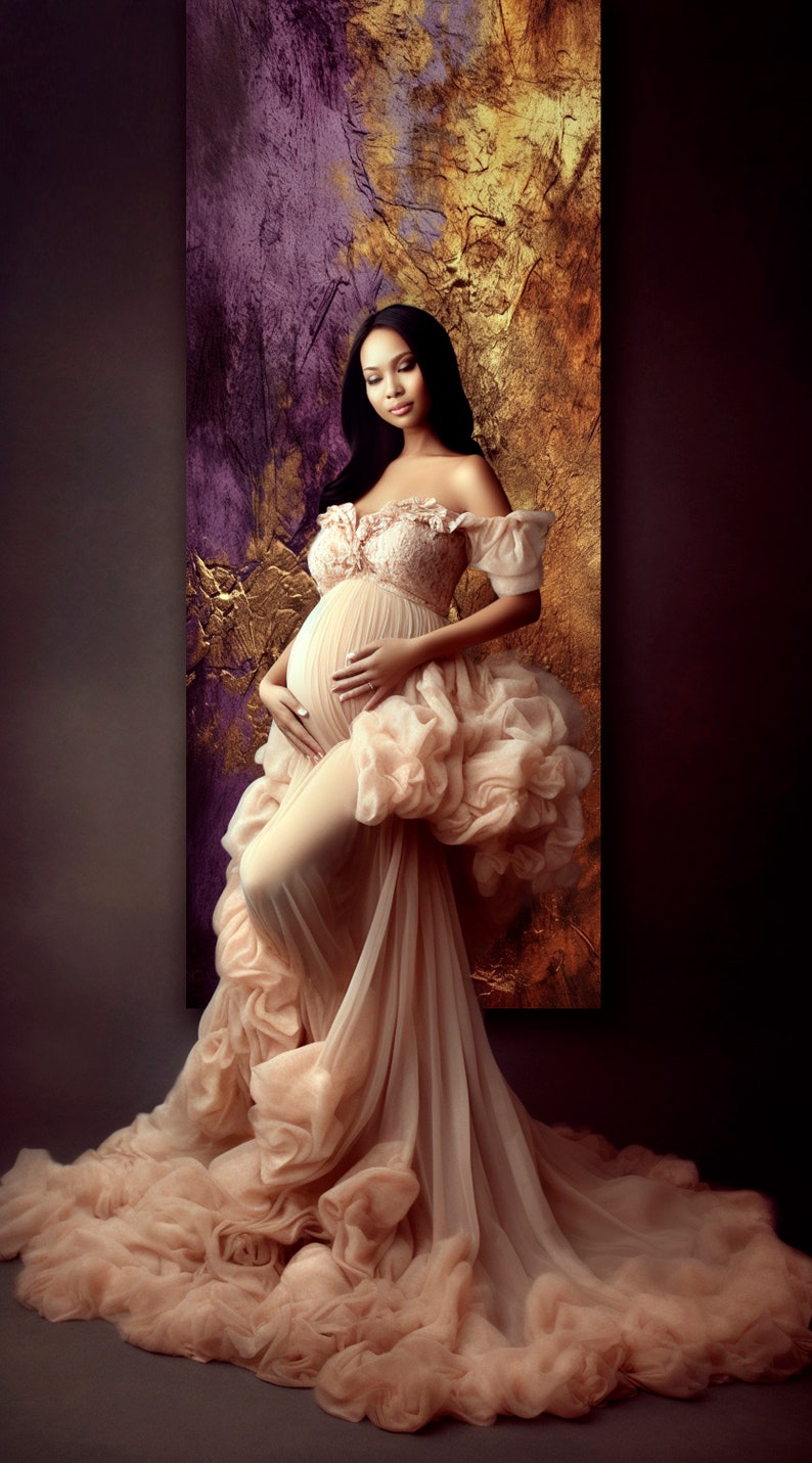 May include: A pregnant woman in a flowing, peach-colored gown with a ruffled skirt and off-the-shoulder neckline. The gown is sheer and has a delicate lace bodice. The woman is standing in front of a textured, gold and purple background.